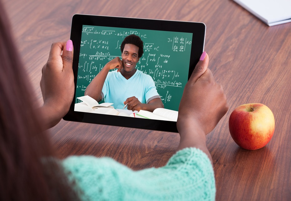 Teacher Assisting Student Through Video Conferencing